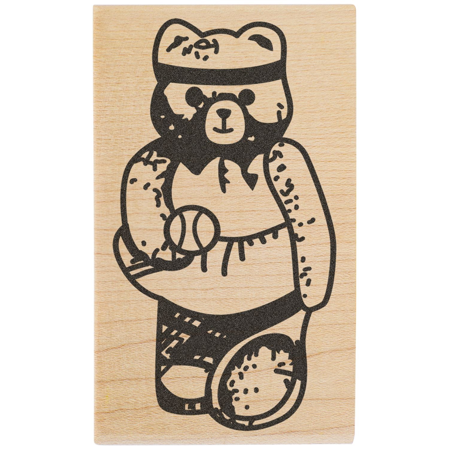 Black bear illustration on a wooden stamp block with rustic engraved-style design.