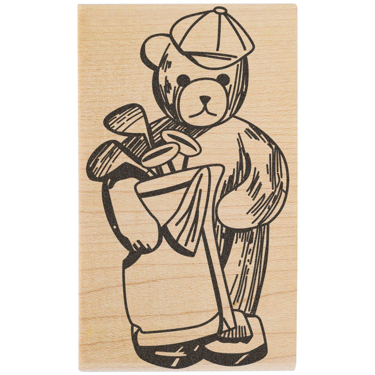 Wooden engraved teddy bear golfer holding golf clubs and wearing a cap on a natural wood background.