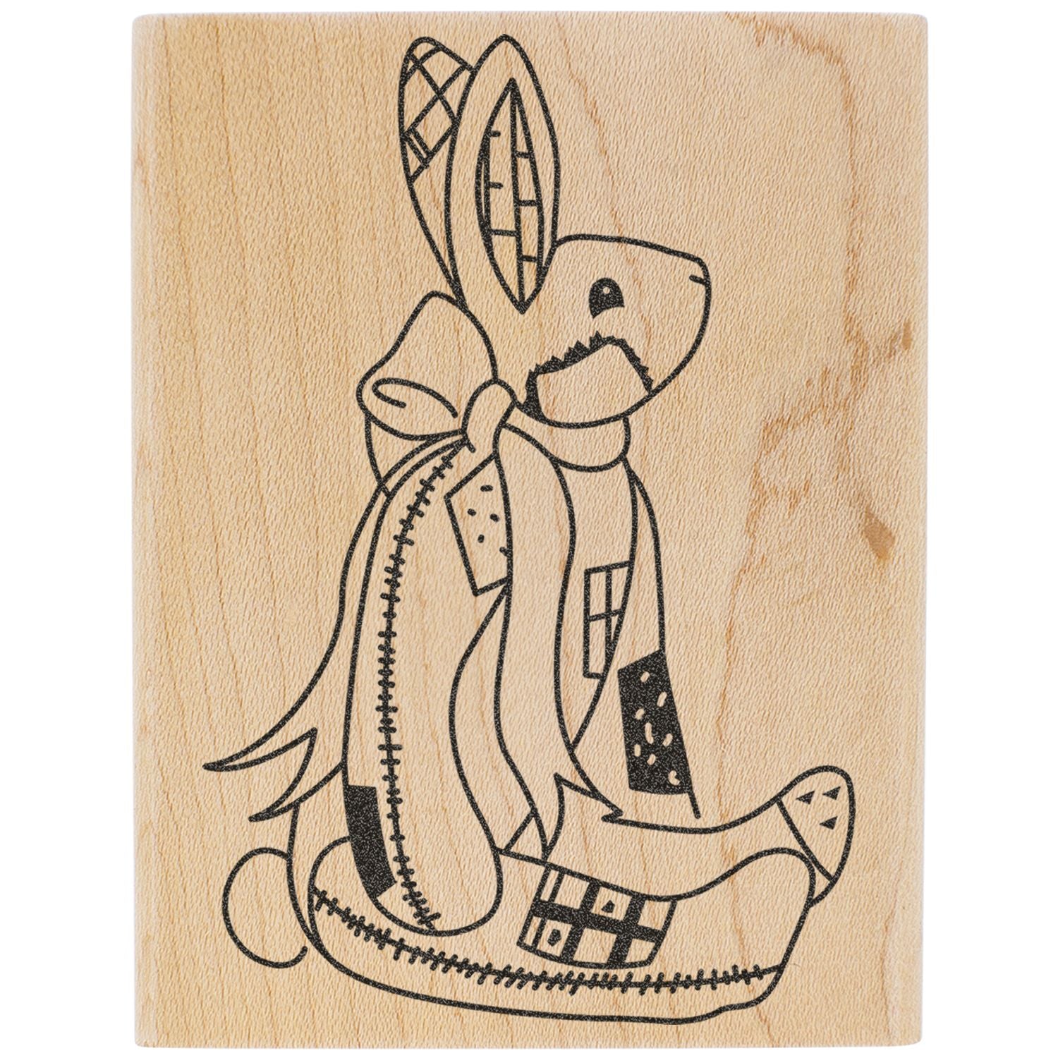 Abstract bunny line art illustration on a textured wood background with patchwork details.