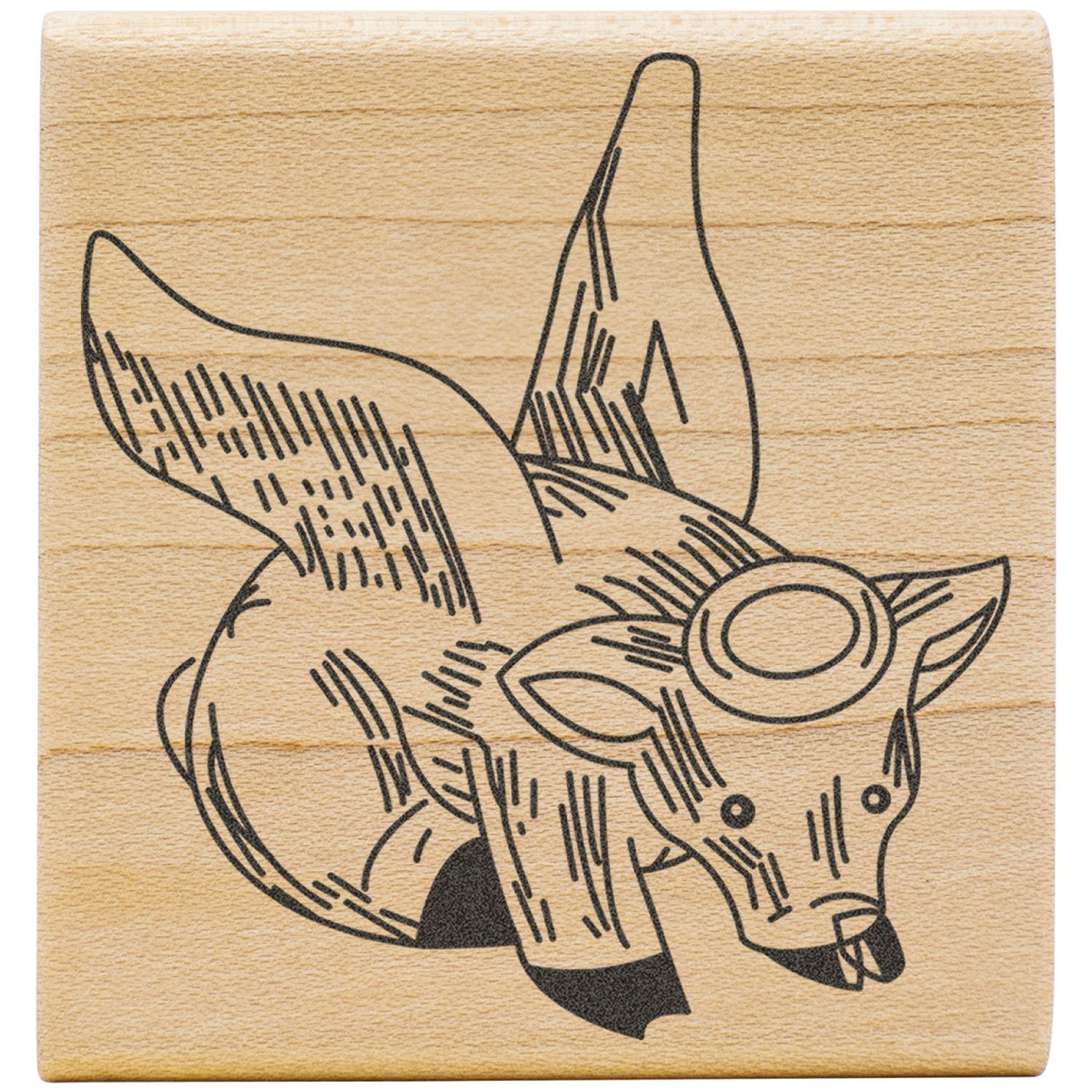 Laser engraved fox illustration on a wooden block, rustic wildlife art design.