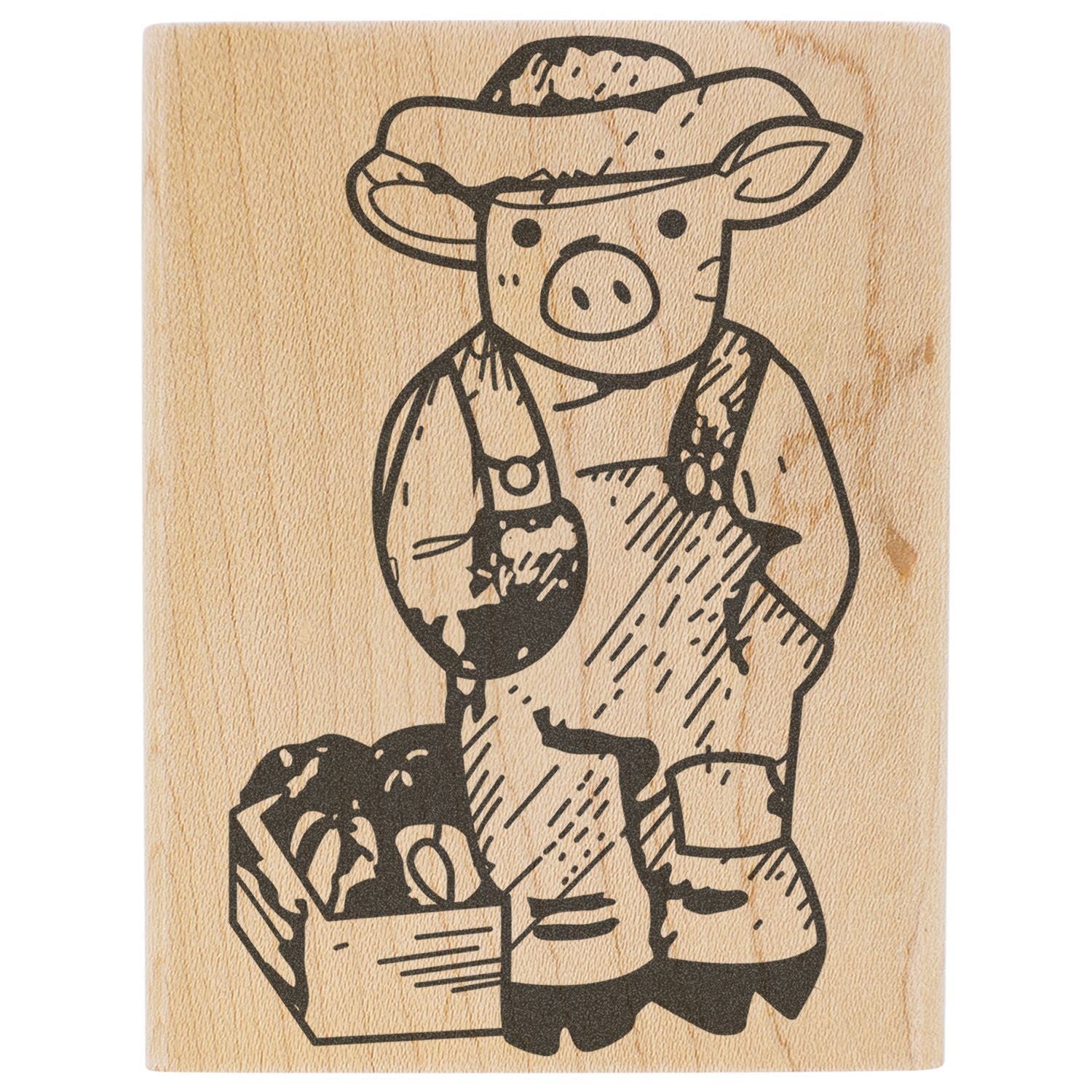 Wooden rubber stamp of a cute pig in overalls, farm animal illustration on a carved block.