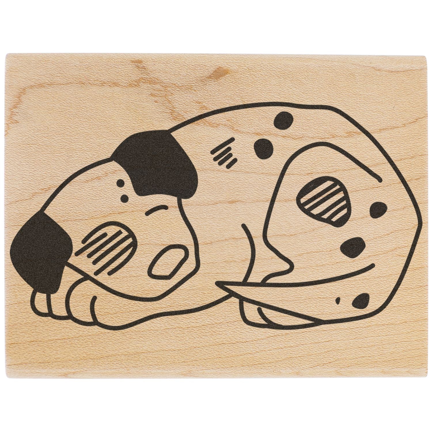 Sleeping dog illustration on a wooden stamp block, cute pet art design on natural wood background