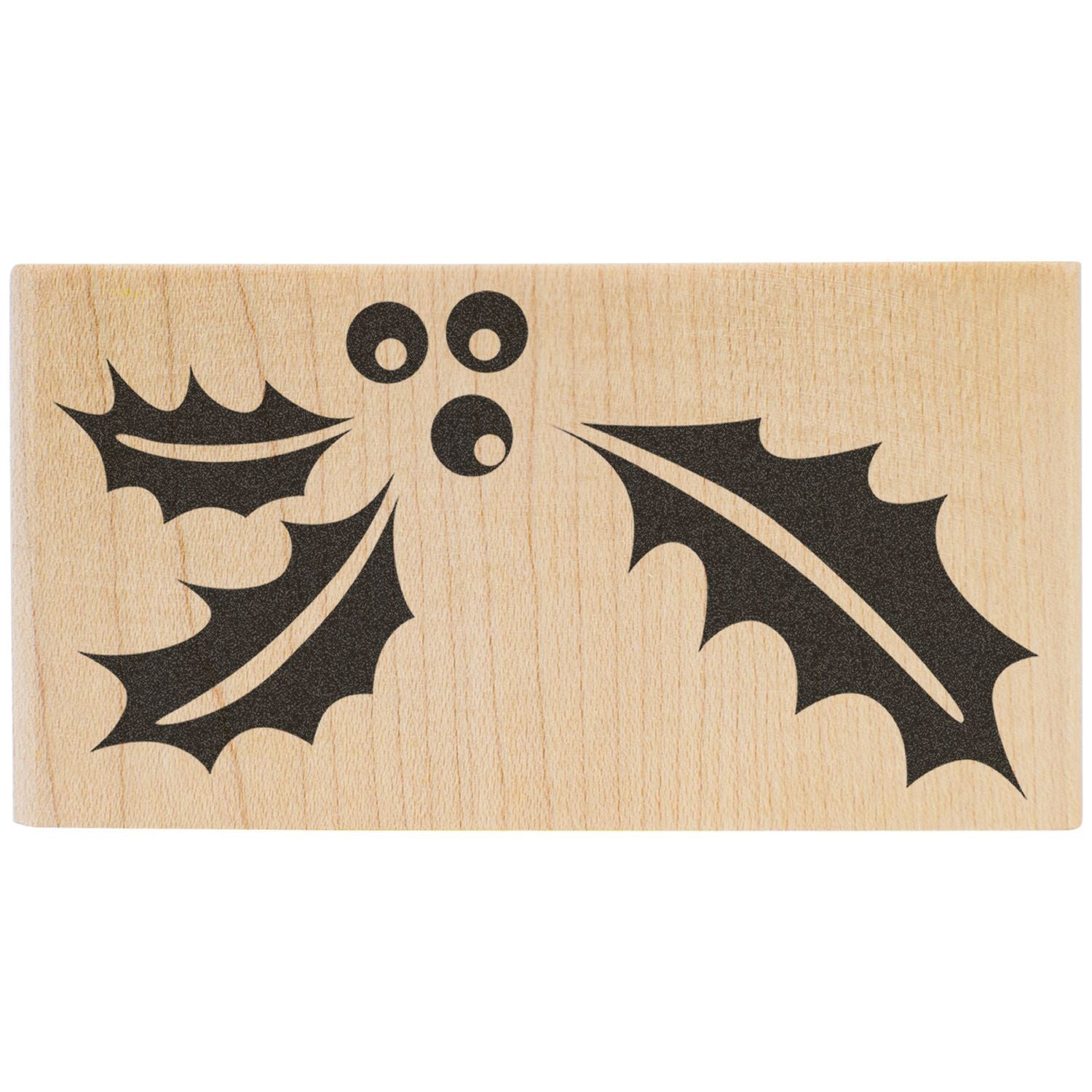 Wooden rubber stamp with holly leaf and berry design for Christmas crafting.