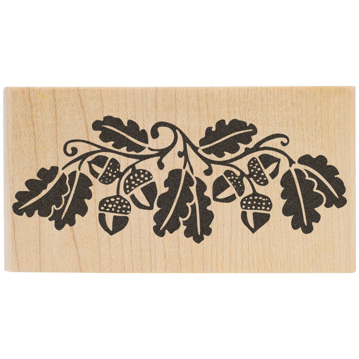 Oak leaf and acorn decorative wooden stamp design on a natural wood block