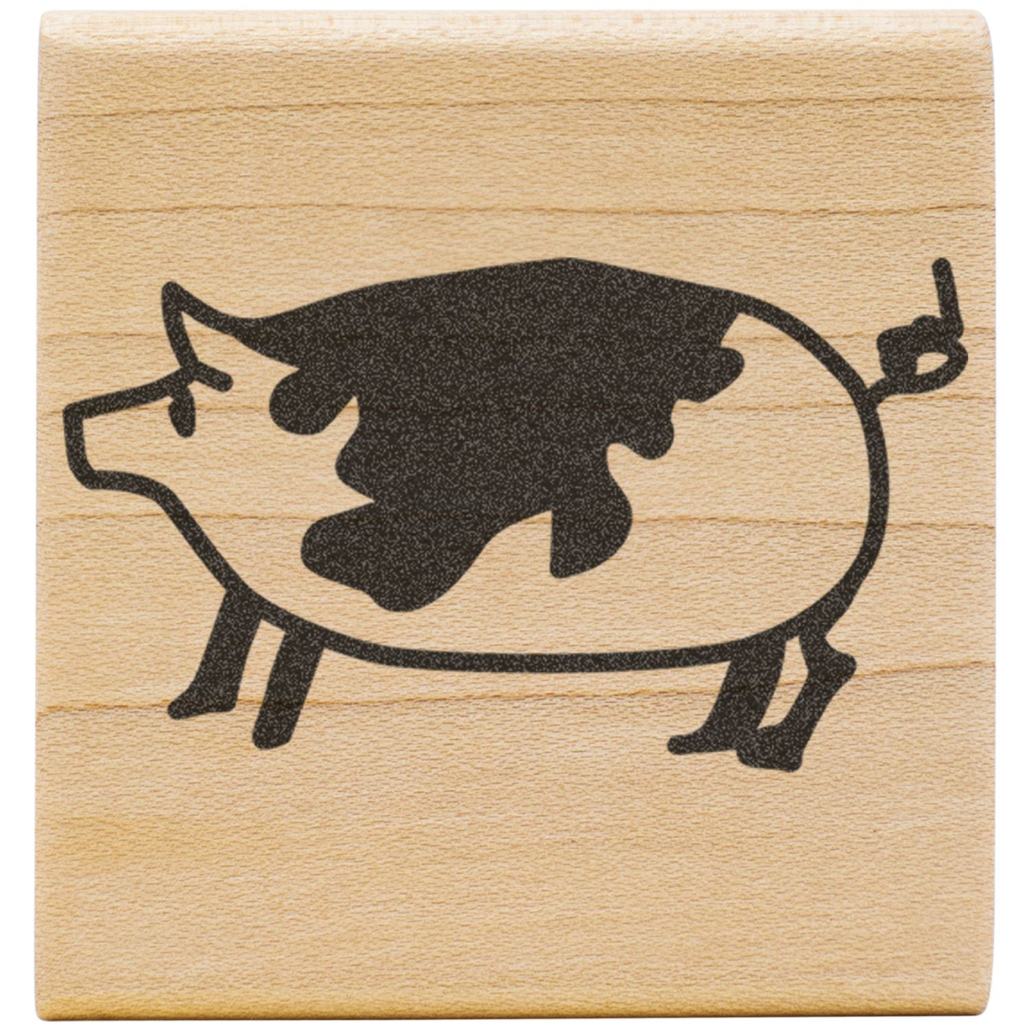 Black pig silhouette with cow spots on a wooden block