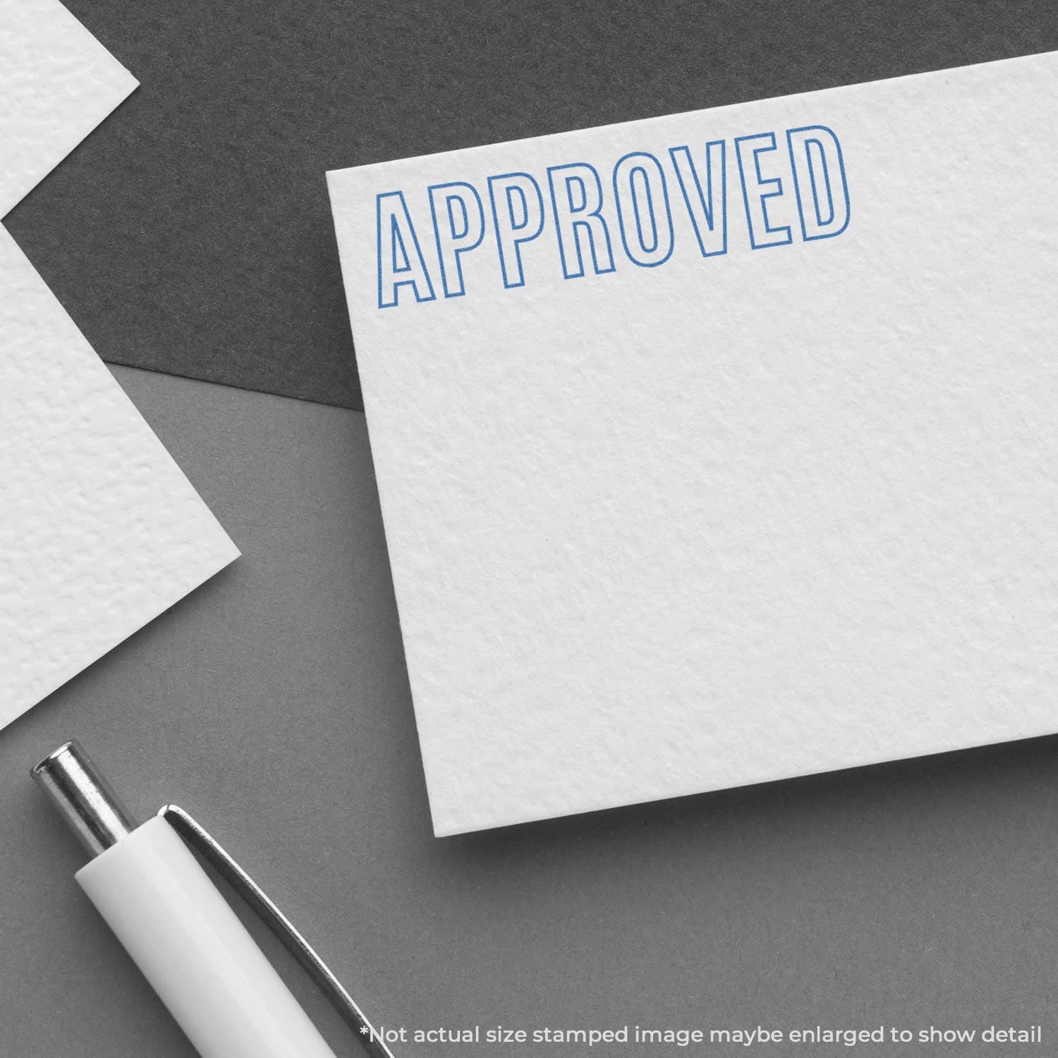 Approved stamp on white paper with pen and documents, conveying contract or application approval workflow.
