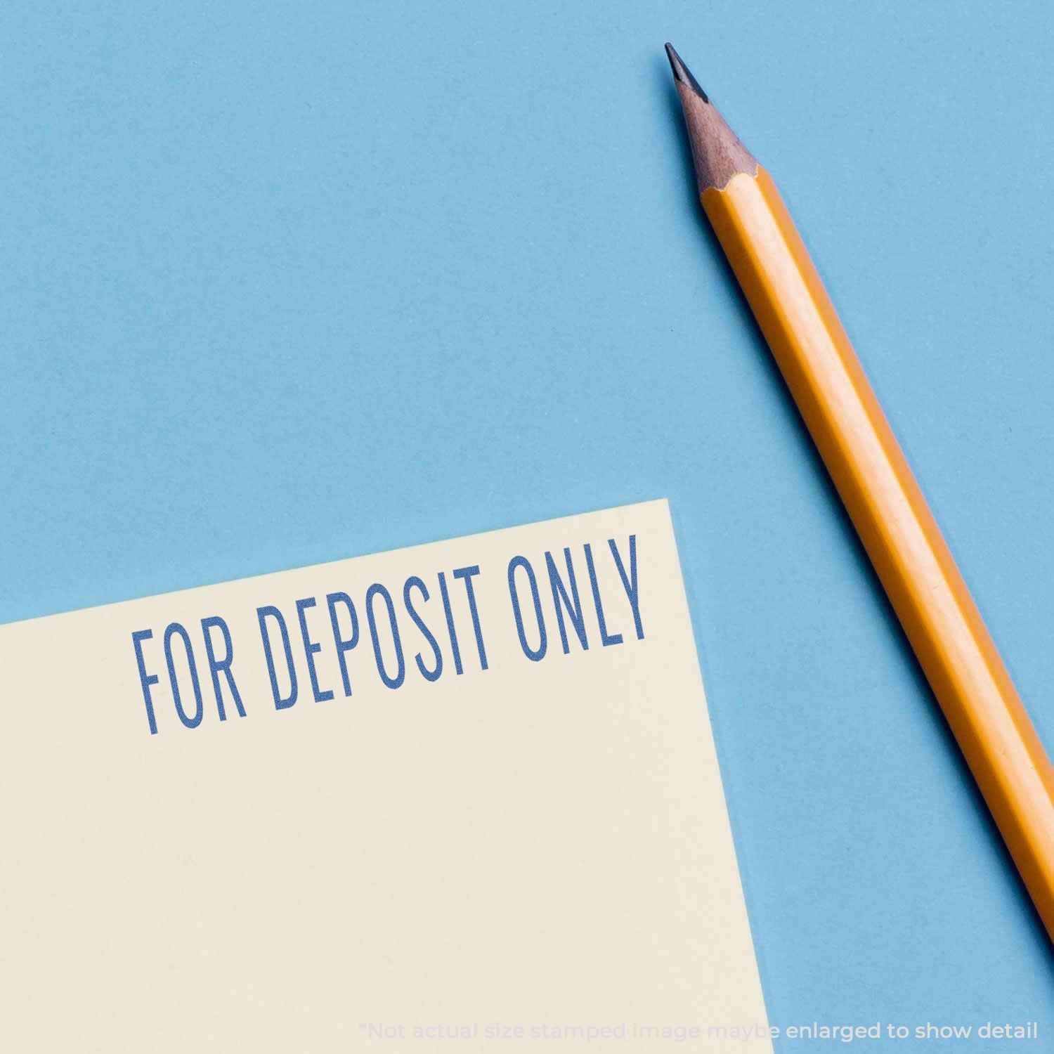 Pencil beside For Deposit Only stamp on banking deposit slip, directing funds for deposit to a specific account.