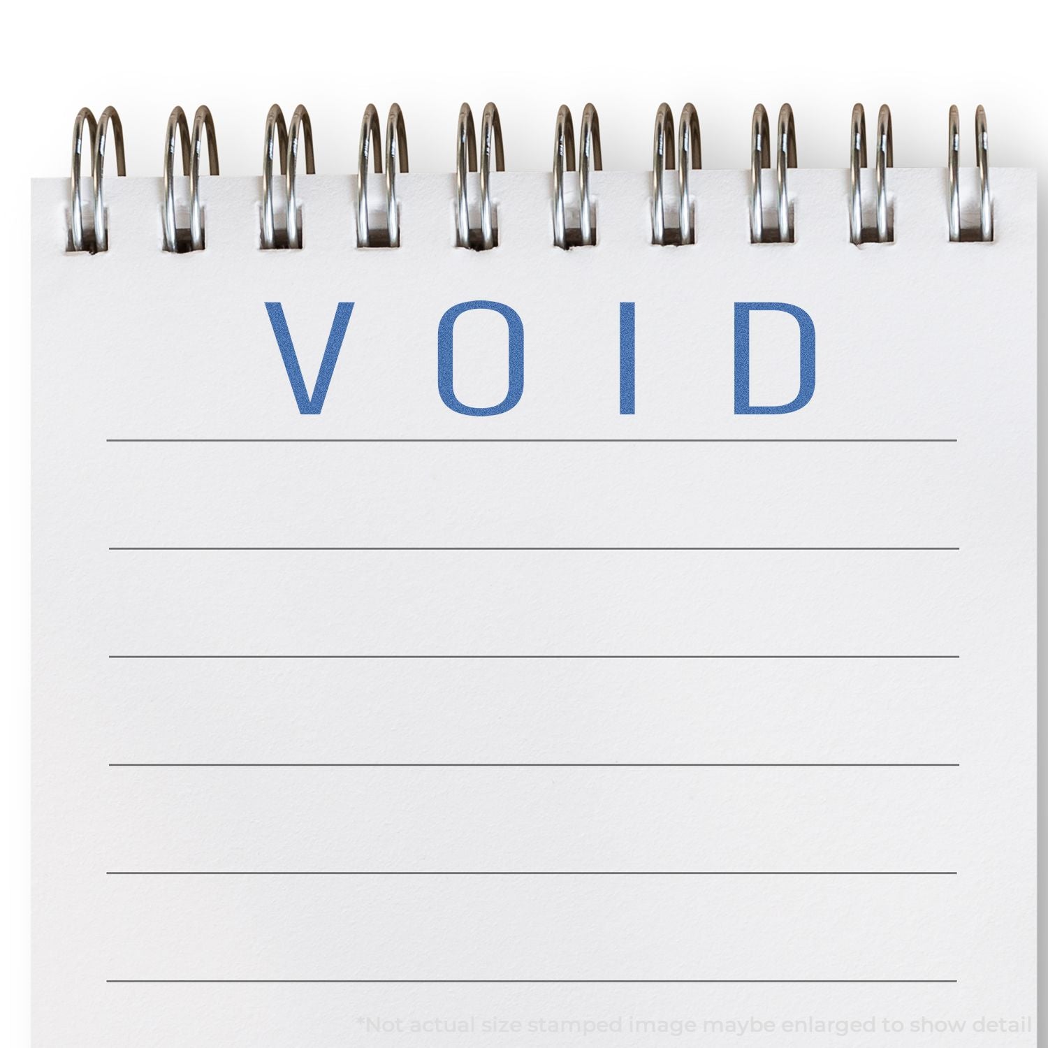 Document VOID stamp with metal binder clips on a blank form, signifying invalid or void status for paperwork and contracts.