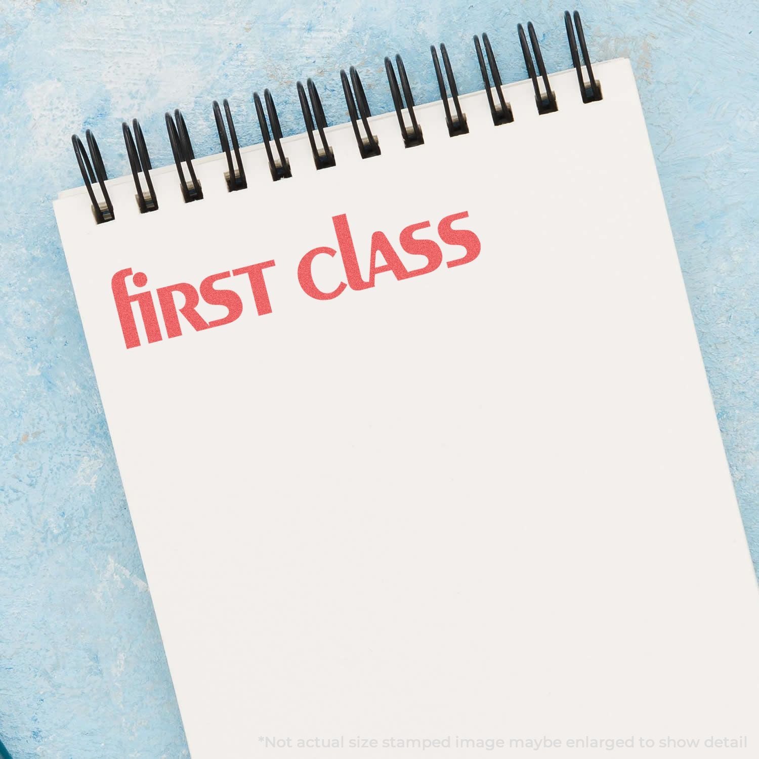 First Class travel service promotional image with FIRST CLASS red title on a desk calendar against a blue background.