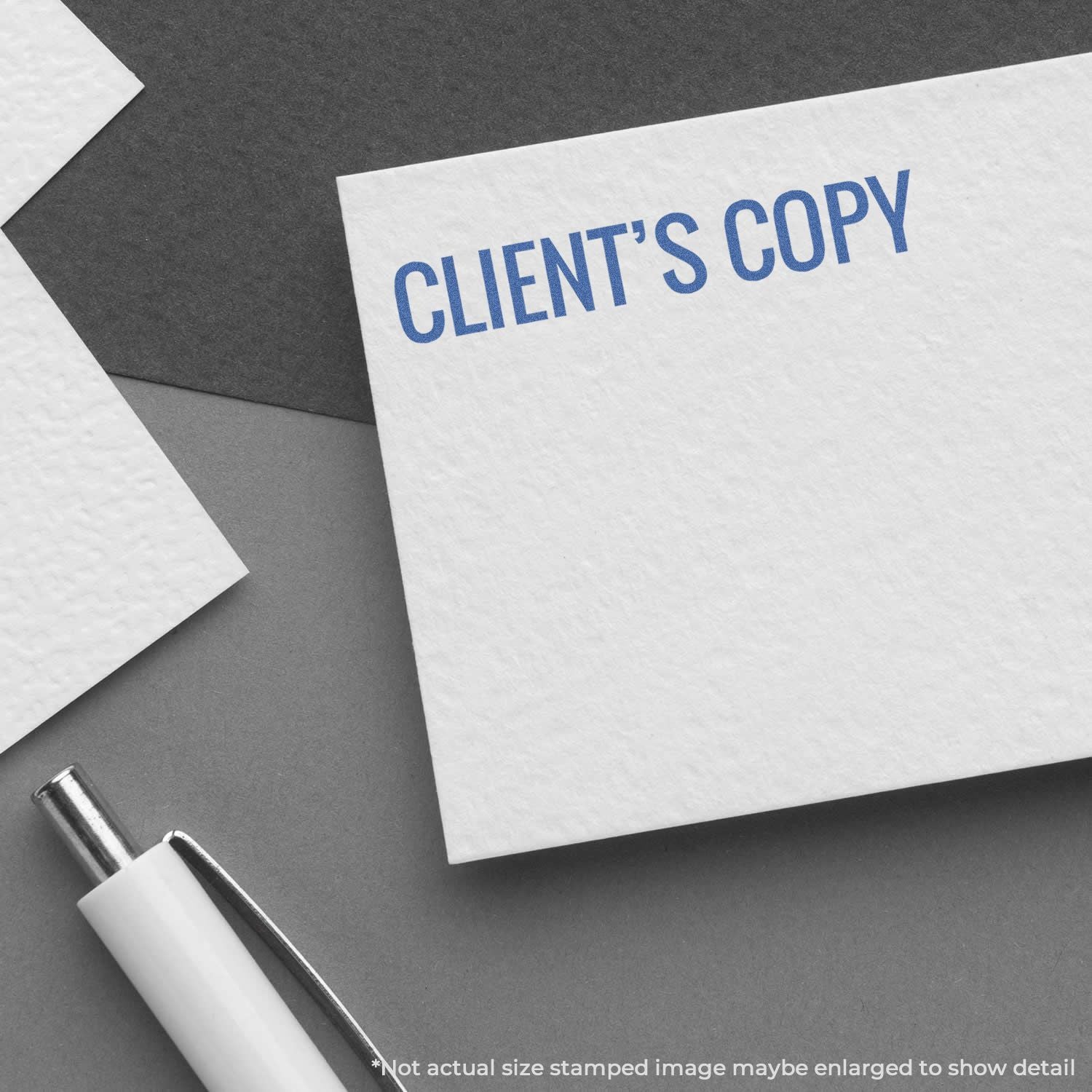 Client's copy stamped on white document with blue CLIENTS COPY text and pen on dark background for printing and archiving.