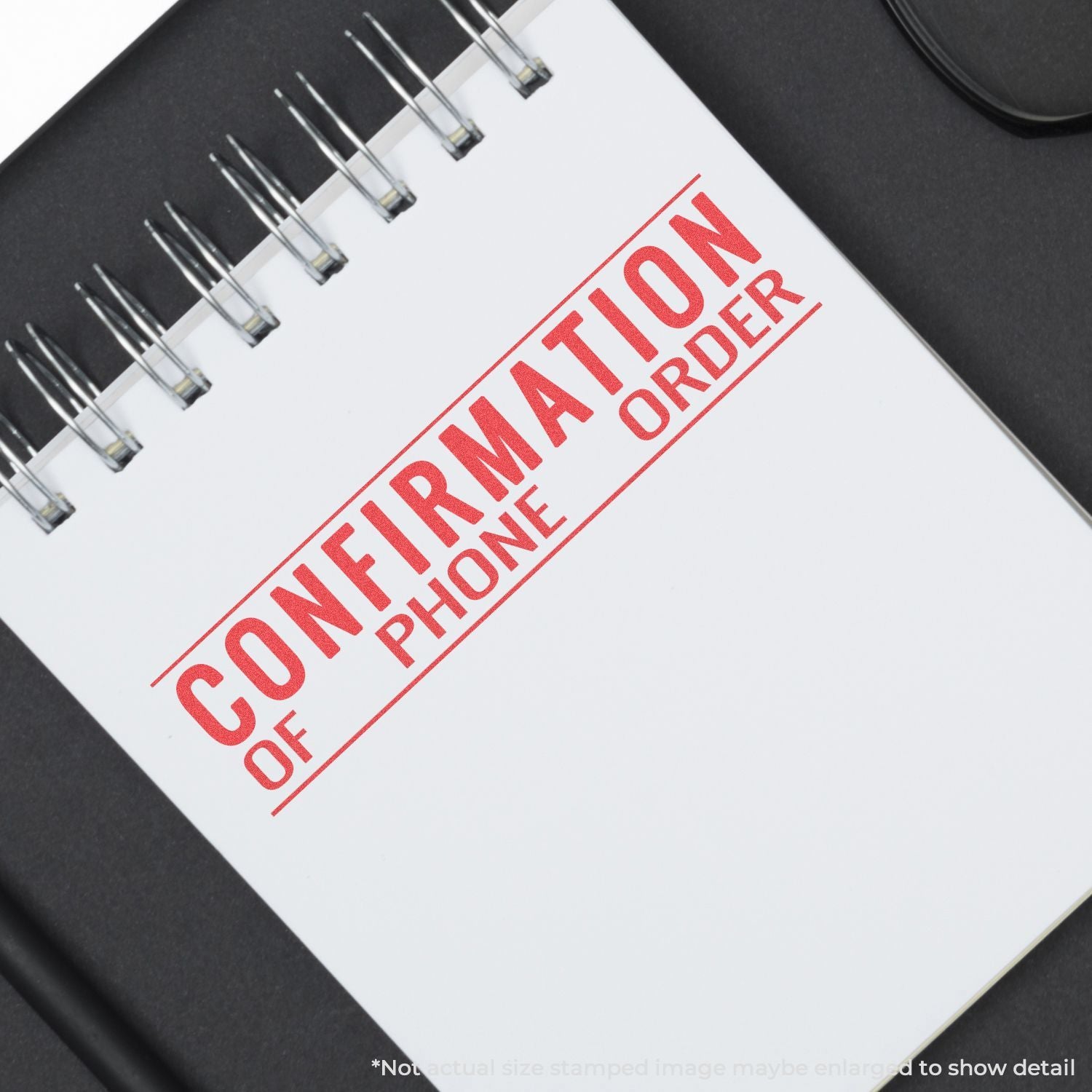 Spiral notebook with bold red stamped motivational quote on cover, ideal for planning, goal tracking, and daily notes.