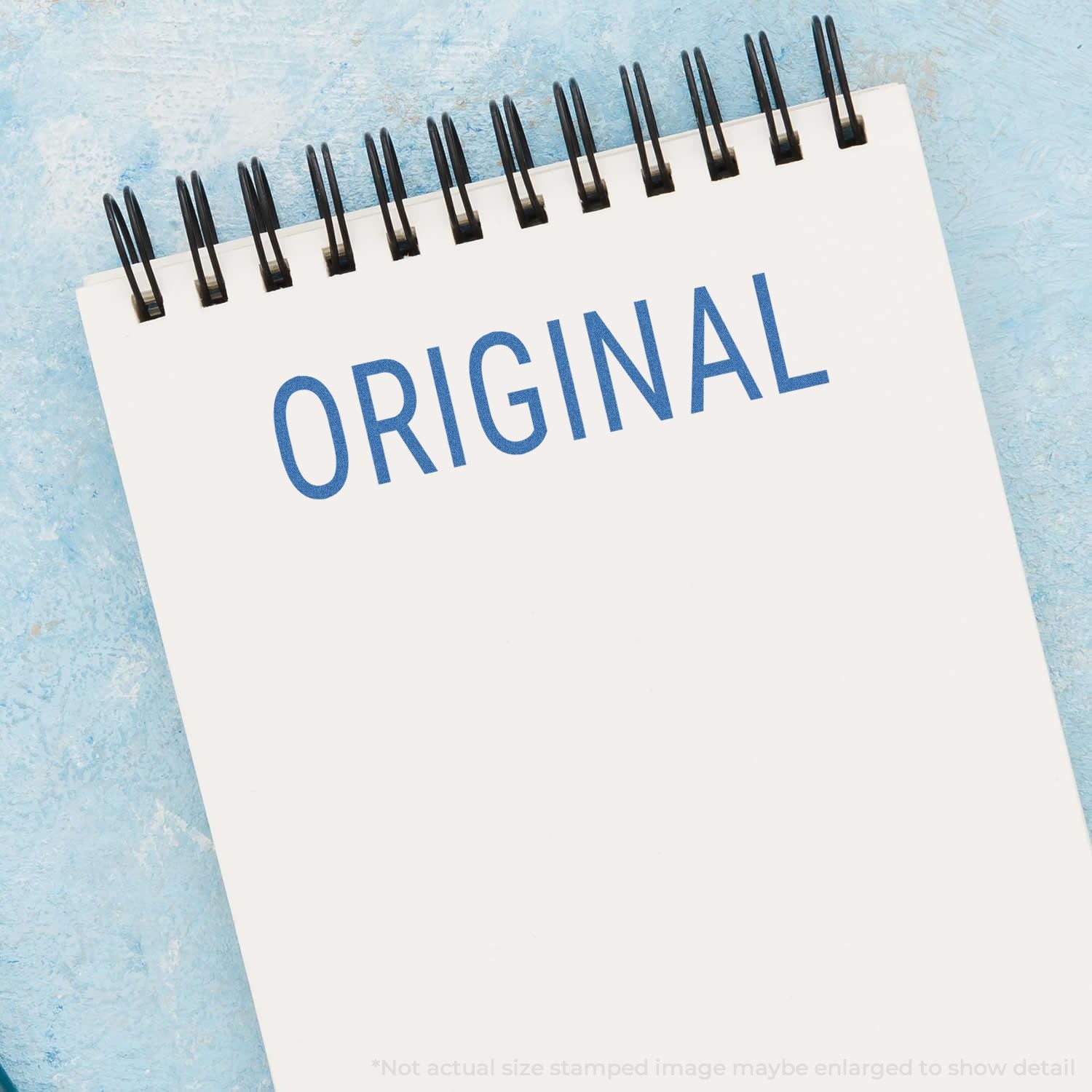 Original calendar page with blue ORIGINAL text and black spiral rings, promotional planner design on a light blue background