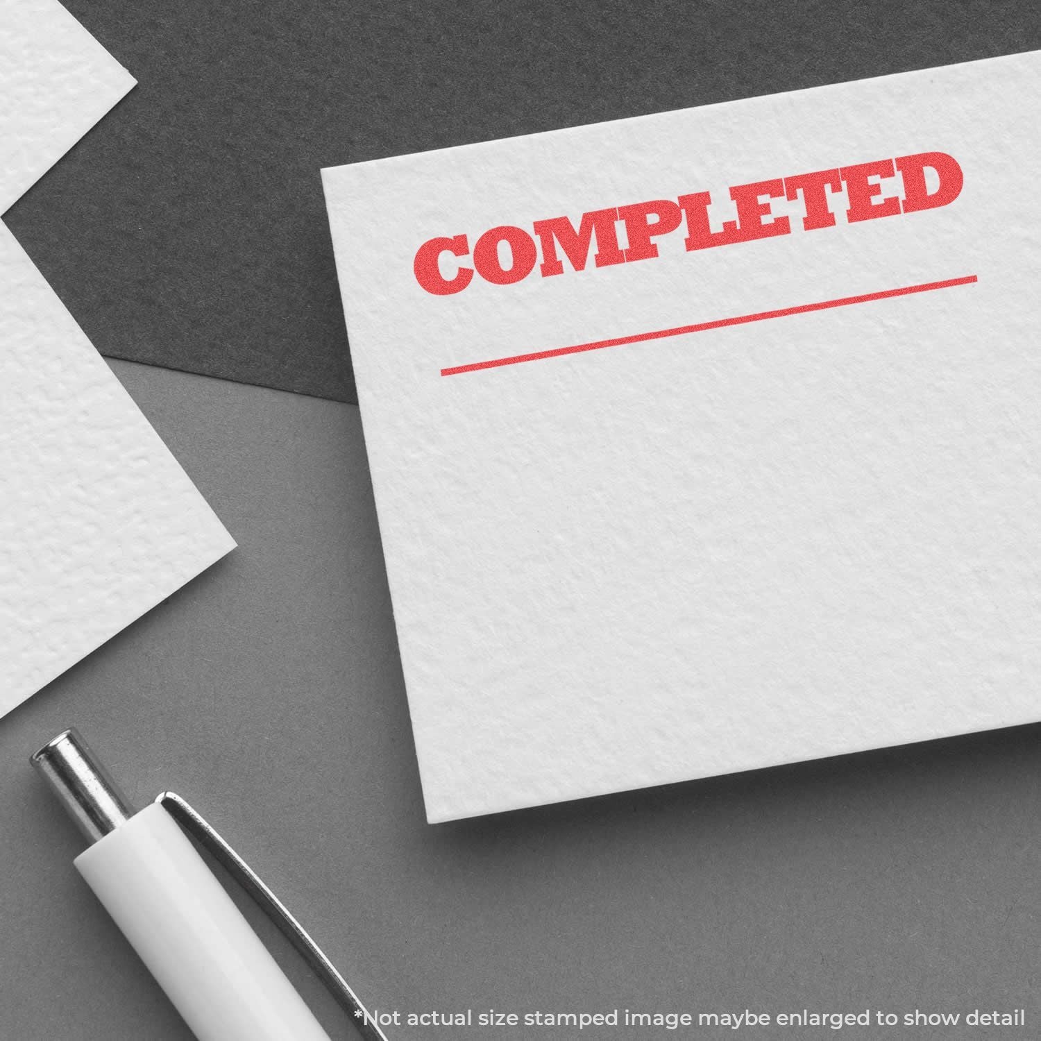 Completed stamp on white paper, business document approval and office paperwork concept.