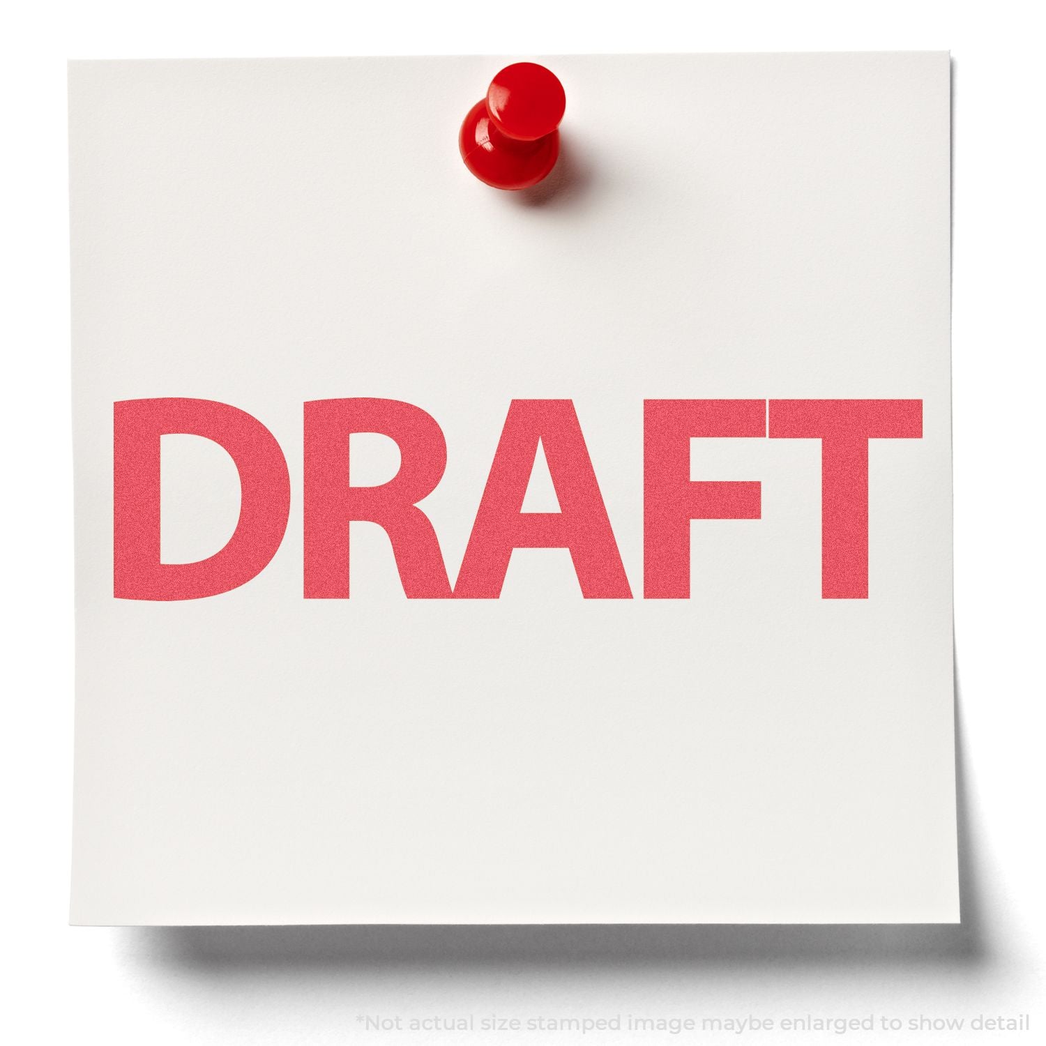 White paper pinned with a red pushpin showing the word DRAFT, indicating a work-in-progress draft document or prototype version.