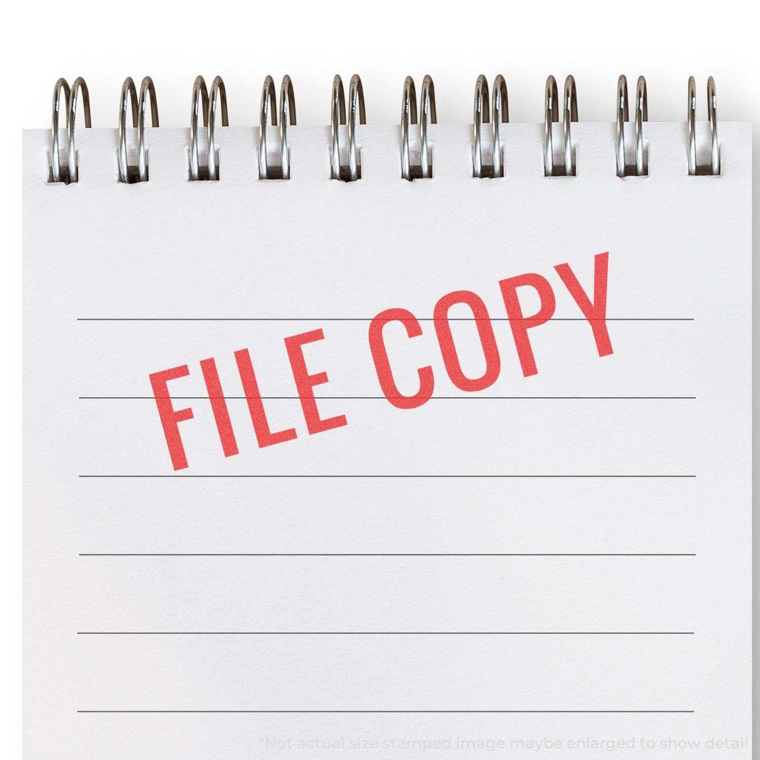 Stamped FILE COPY paperwork image with metal staples on top, marking a filed duplicate for office record keeping and archiving document management workflow.