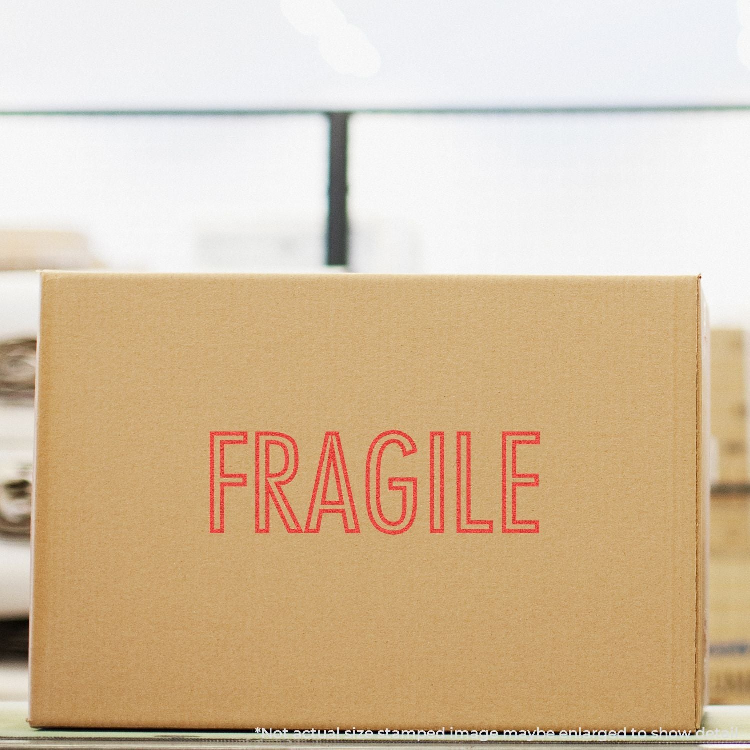 Fragile stamped shipping box on packing surface, showing careful delivery packaging for eCommerce shipping and moving services handling