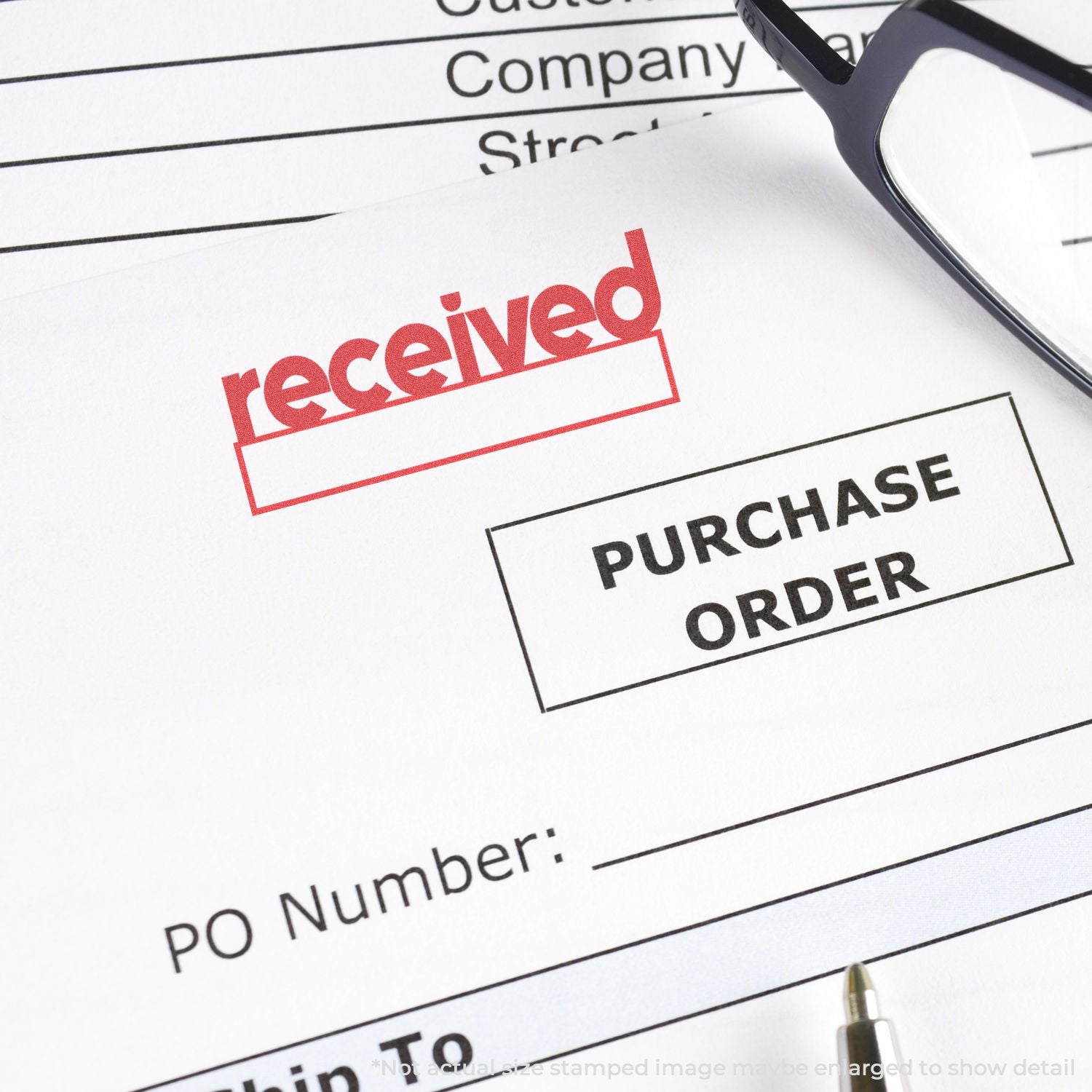Received stamp on purchase order document with glasses, indicating processed orders and confirmation in business operations.