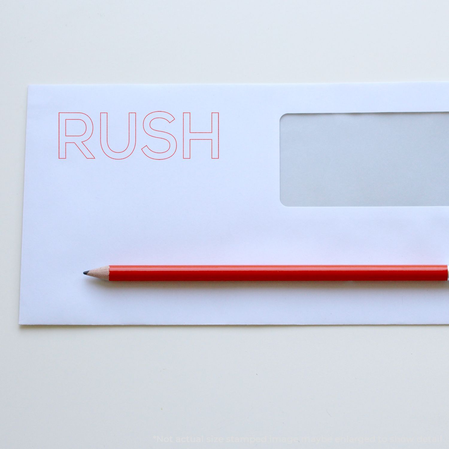 White notepad showing RUSH in red with a pencil, conveying urgent deadline and fast, high-priority action for business