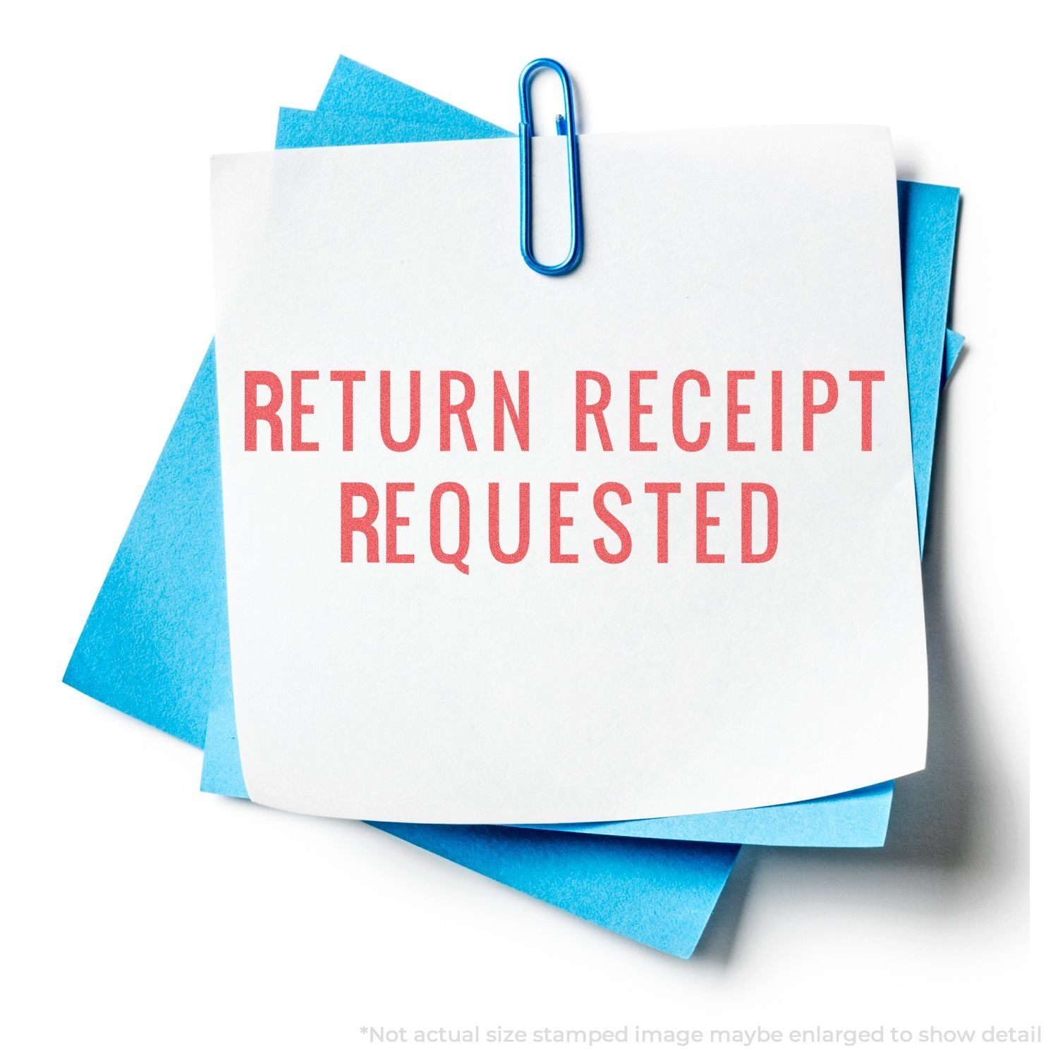 Return receipt requested mail card with paper clip, indicating postal service proof of delivery for registered documents.