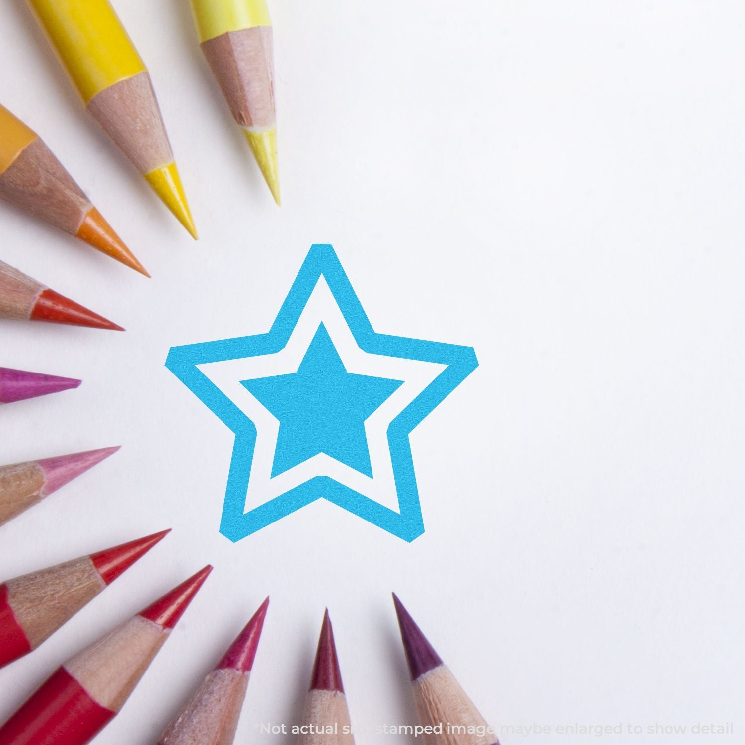 Colored pencils around a blue star drawing on a white background, symbolizing creativity, education, and art projects.