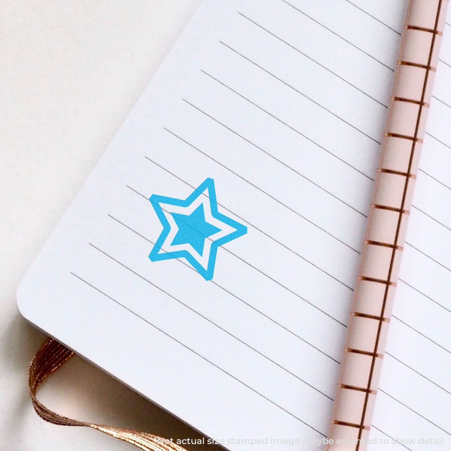 Blue star icon on lined notebook page, symbolizing goal setting, productivity, and planning in a study or work planner.