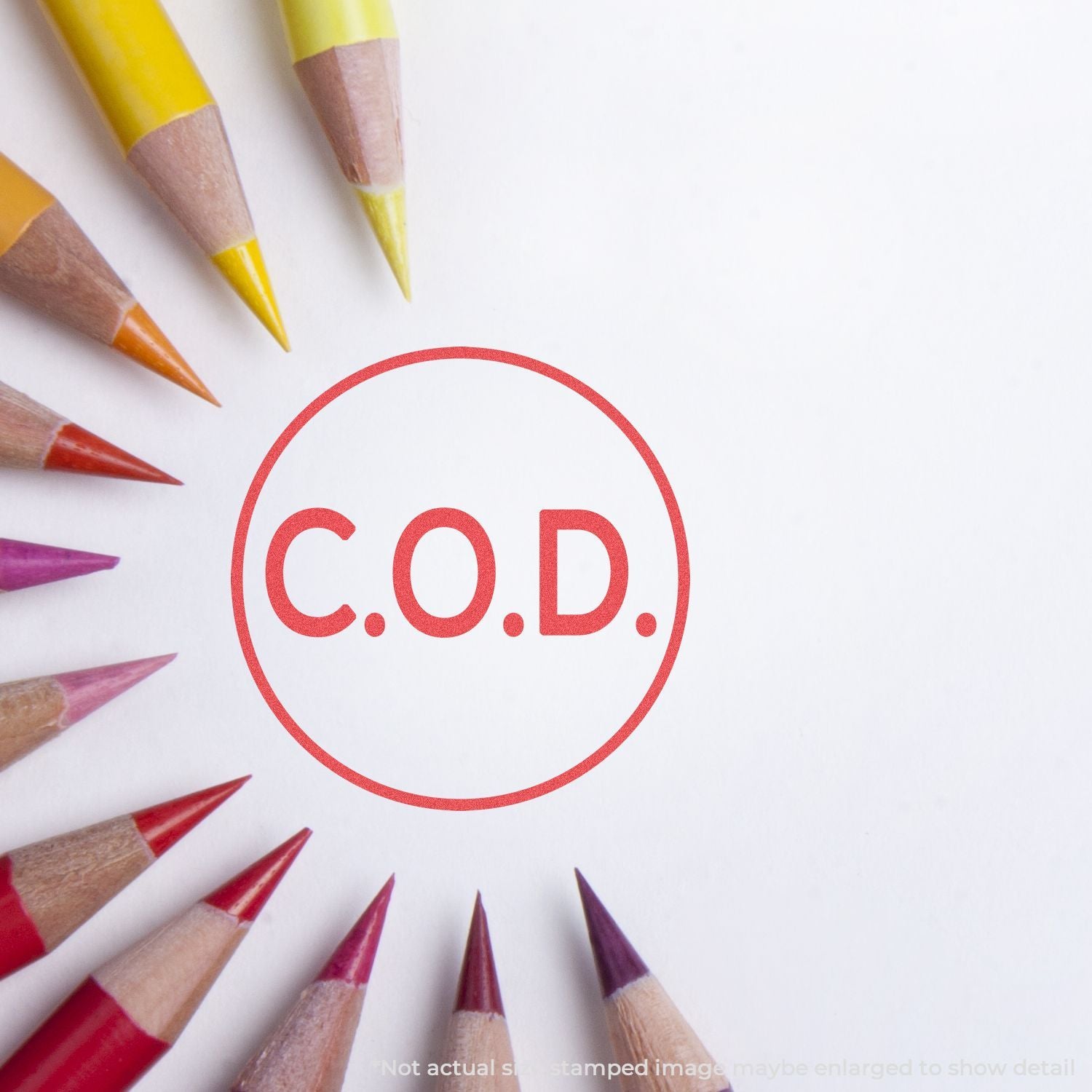 Colored pencils framing a red C.O.D. stamp on white background, highlighting creative learning and letter writing.
