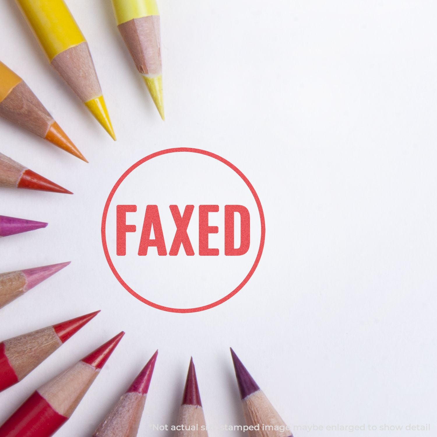 Colored pencils frame a red FAXED stamp on a white background, symbolizing faxed documents and communication confirmation.